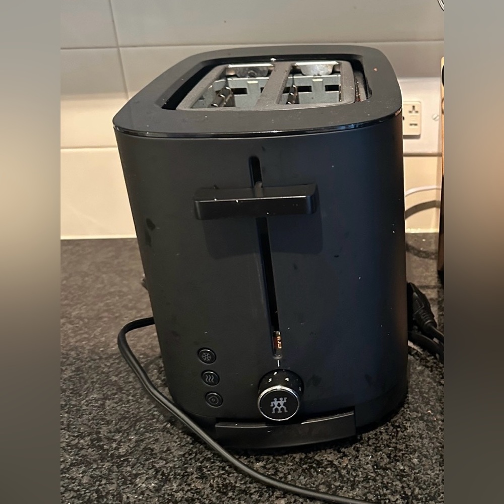 This is a Zwilling matte black 2 short slots toaster with 3 automatic programmes